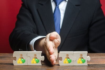 Man splitting a puzzle with his hand