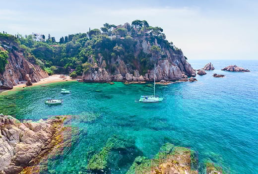 yacht sailing on spanish coastline
