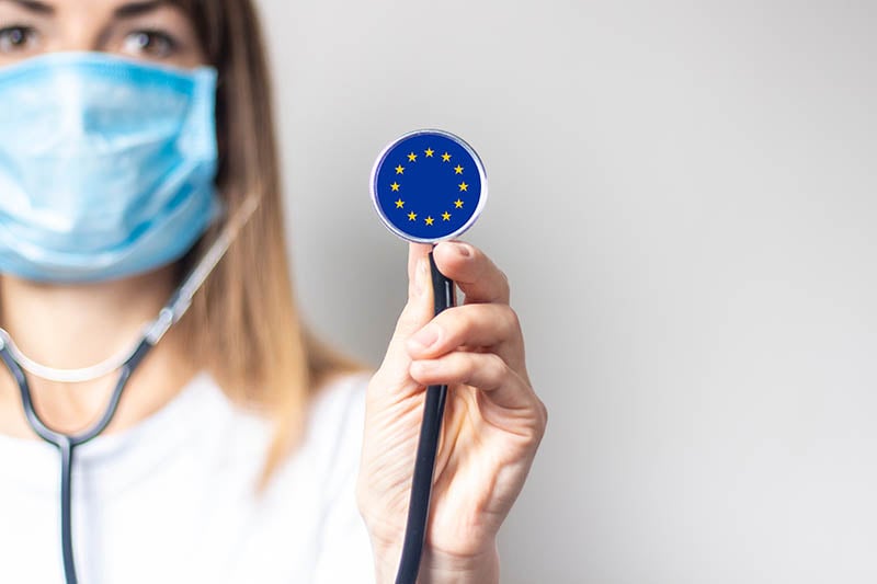 doctor holding stethoscope with eu flag