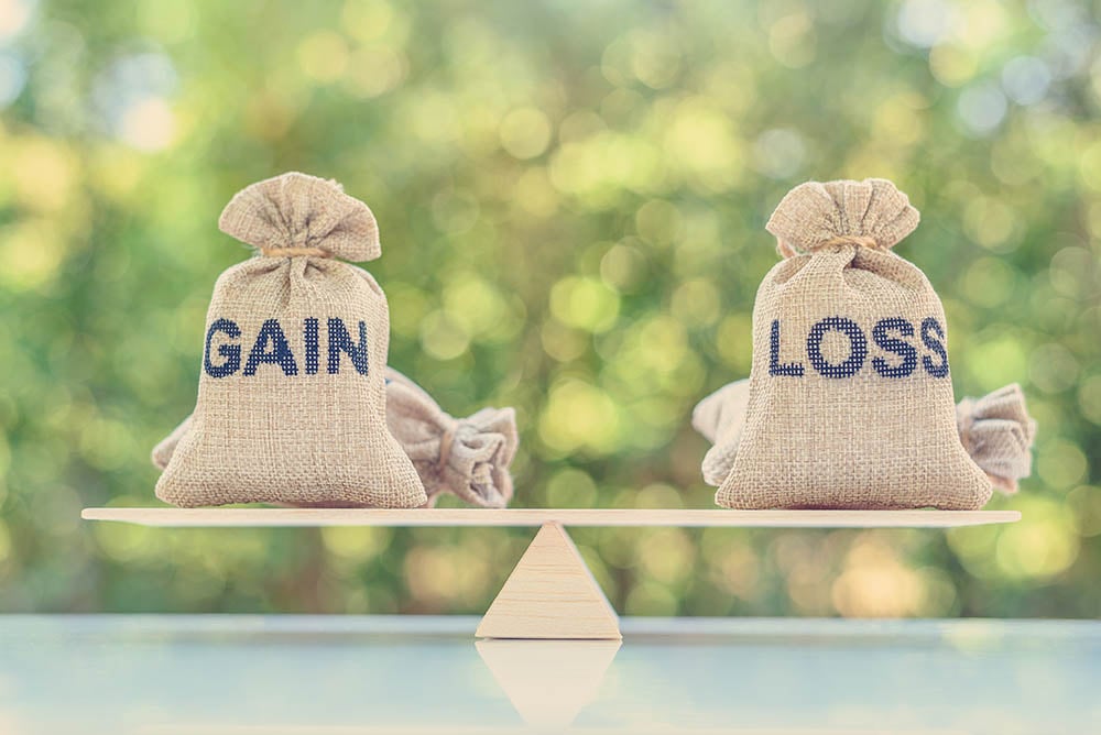 gains and loss sacks on a scale