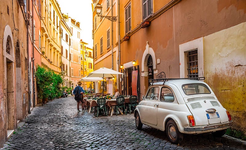 italian street with fiat 500 parked