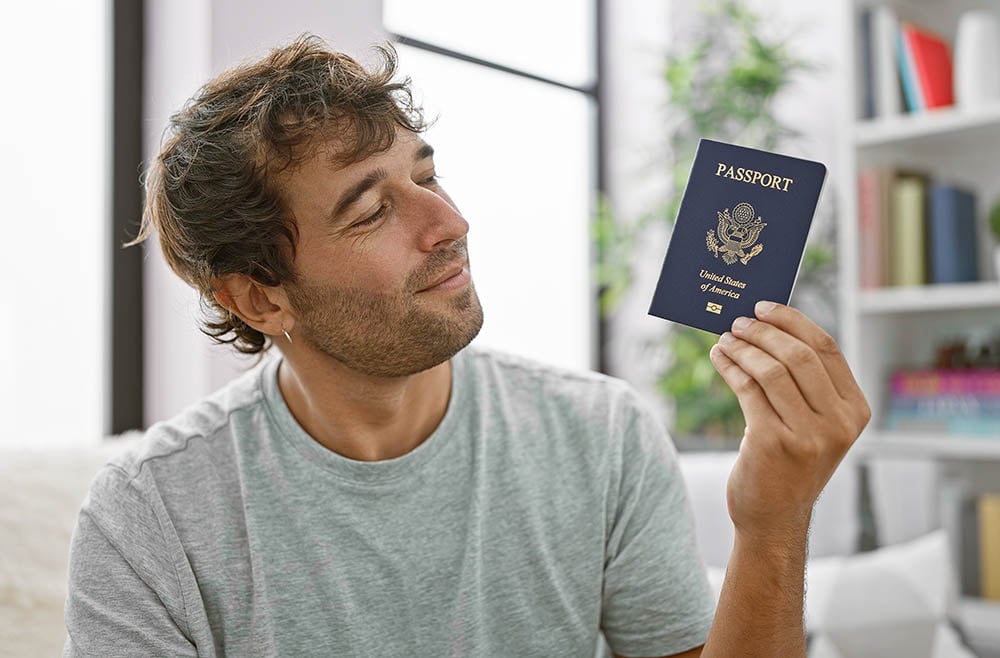 man holding a us passport