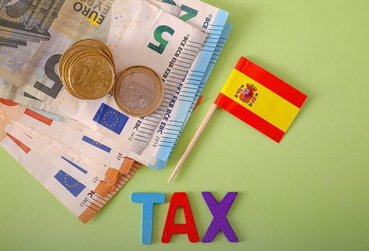 spain flag with euros and tax sign