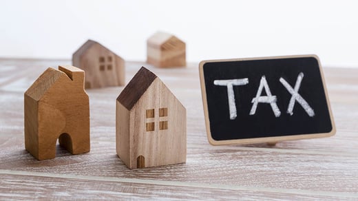 tax sign and a house