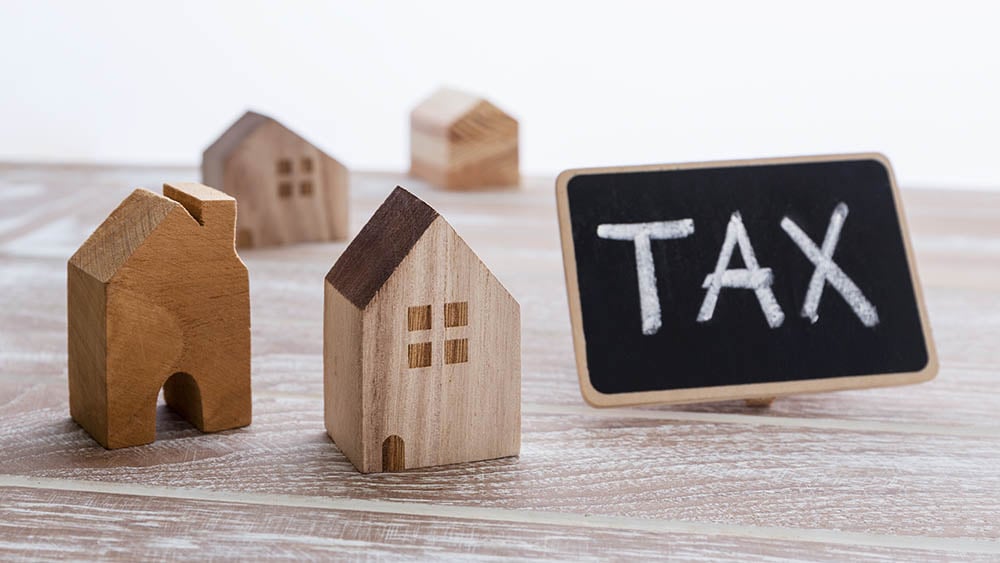 tax sign and a house