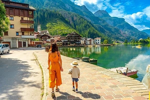 woman and child walking in dolomites