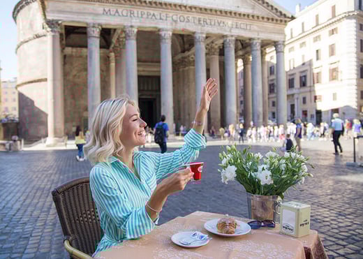 woman drinking coffee in rome