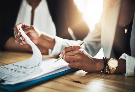 woman going through mortgage paperwork
