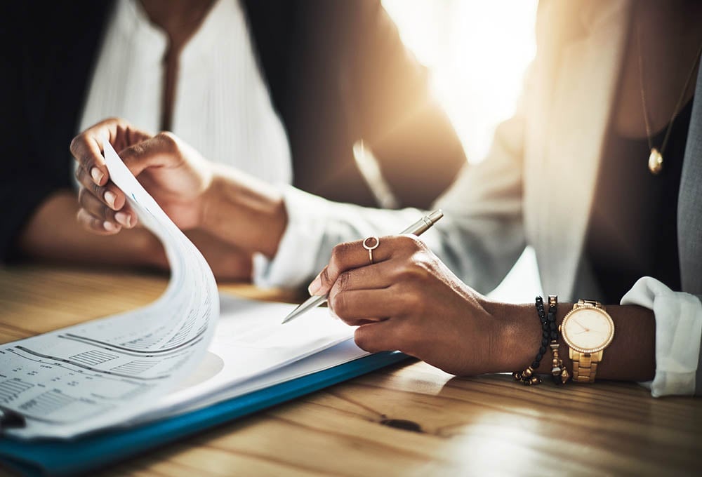 woman going through mortgage paperwork