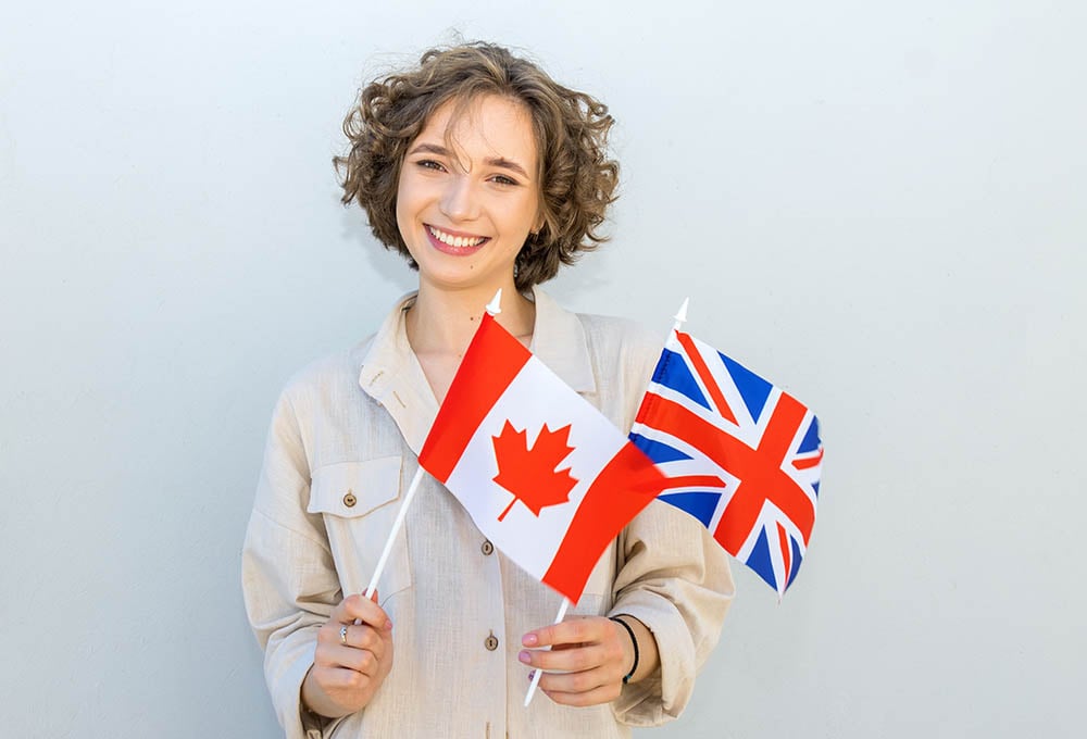 woman holding canada and uk flag