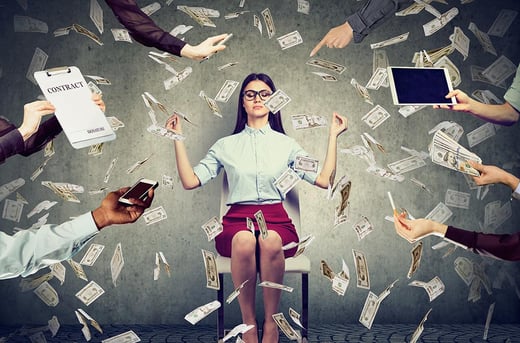 woman sitting in chaos with money